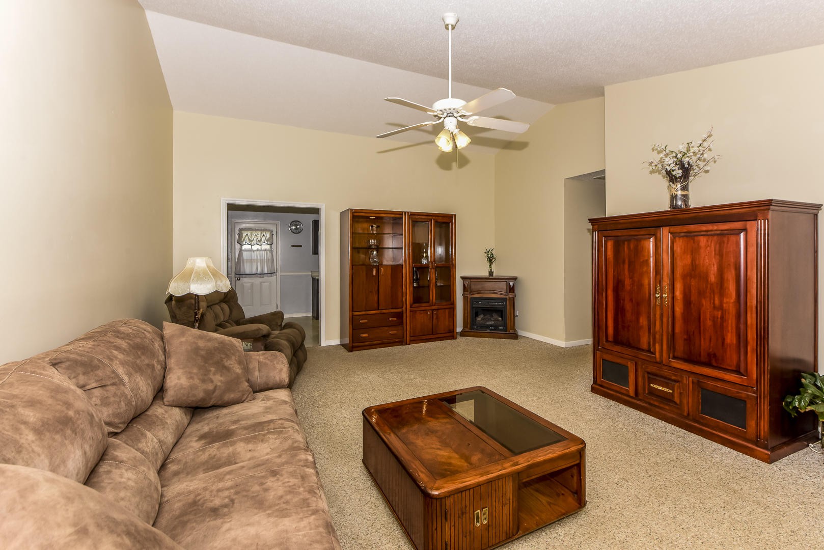 1409 Lambert Road Greenback, TN 37742 - Photo 6 of 28 a living room with furniture and a chandelier
