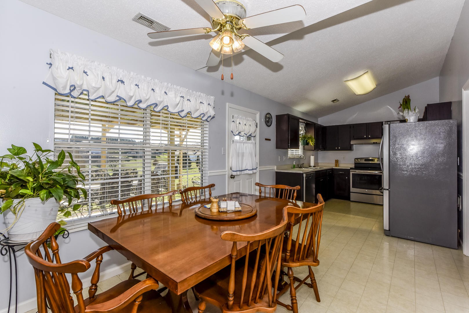 1409 Lambert Road Greenback, TN 37742 - Photo 8 of 28 a view of a dining room with furniture window and wooden floor