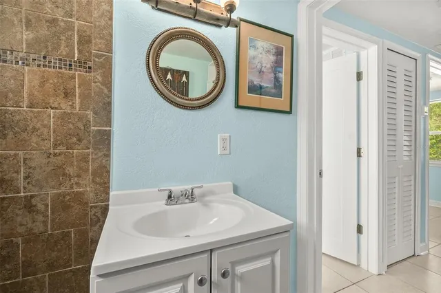 a bathroom with a sink a mirror and a toilet