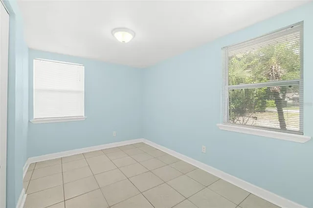 a view of an empty room and a window