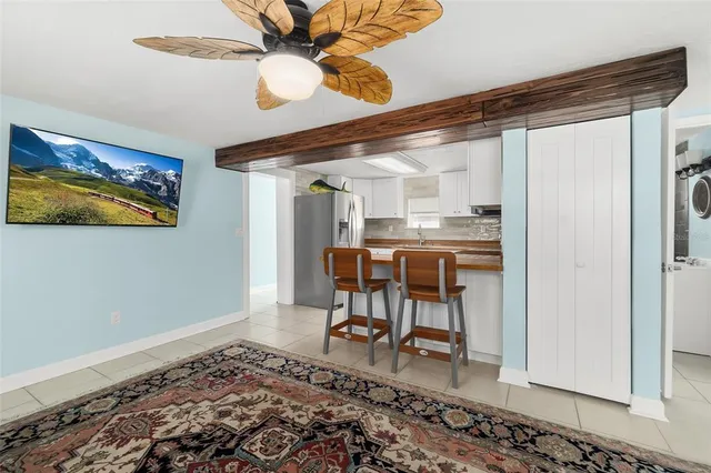 a workspace with wooden floor and a window