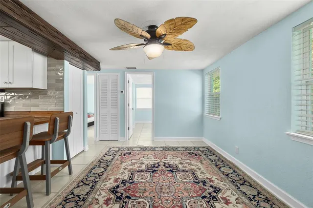a view of a livingroom with wooden floor and furniture