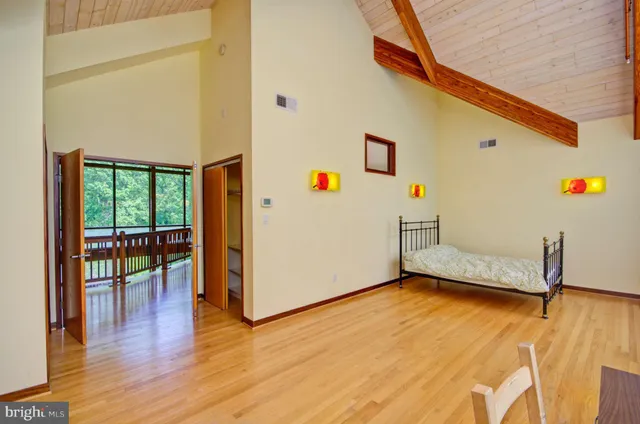 a bedroom with furniture and a window