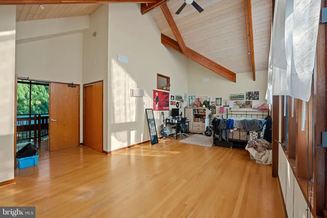 a bathroom with a bathtub sink vanity and mirror