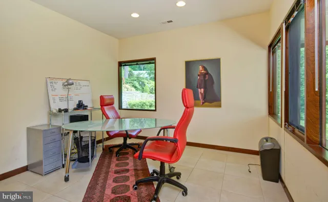 a view of a two chairs in the balcony