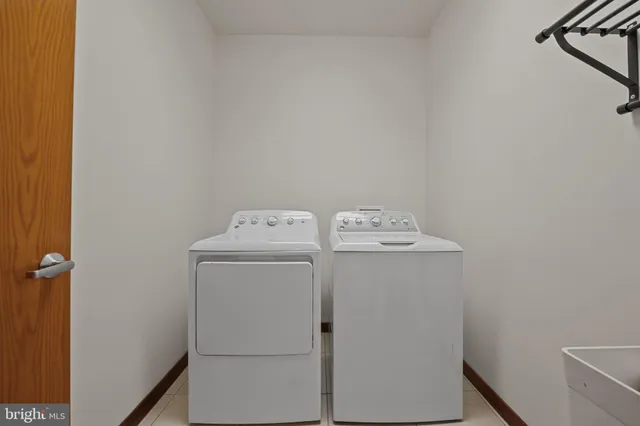 a view of a house with backyard porch and sitting area