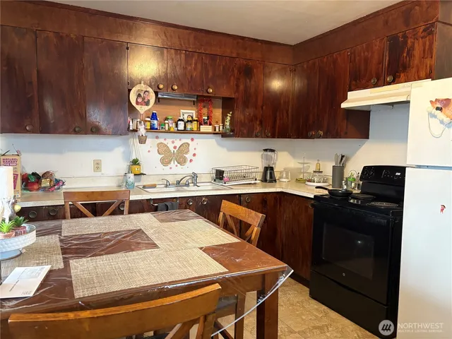 a kitchen with a sink and cabinets