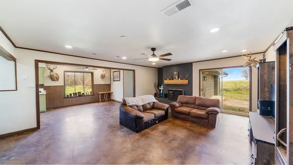 a very nice looking room with a large window and chandelier