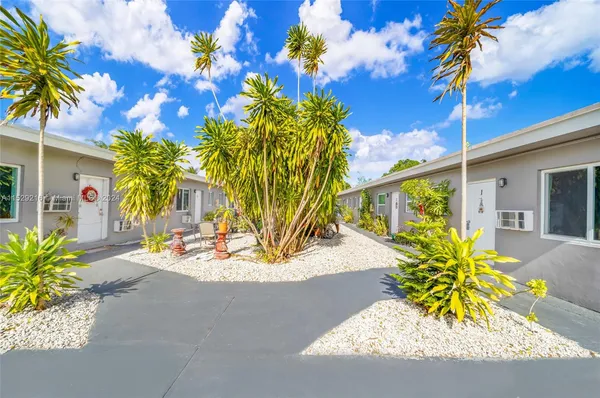 a view of a backyard with a patio