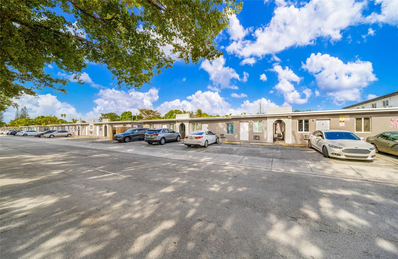 1219 Sharazad Boulevard Opa-Locka, FL 33054 - Photo 12 of 16 a car parked on the side of a street