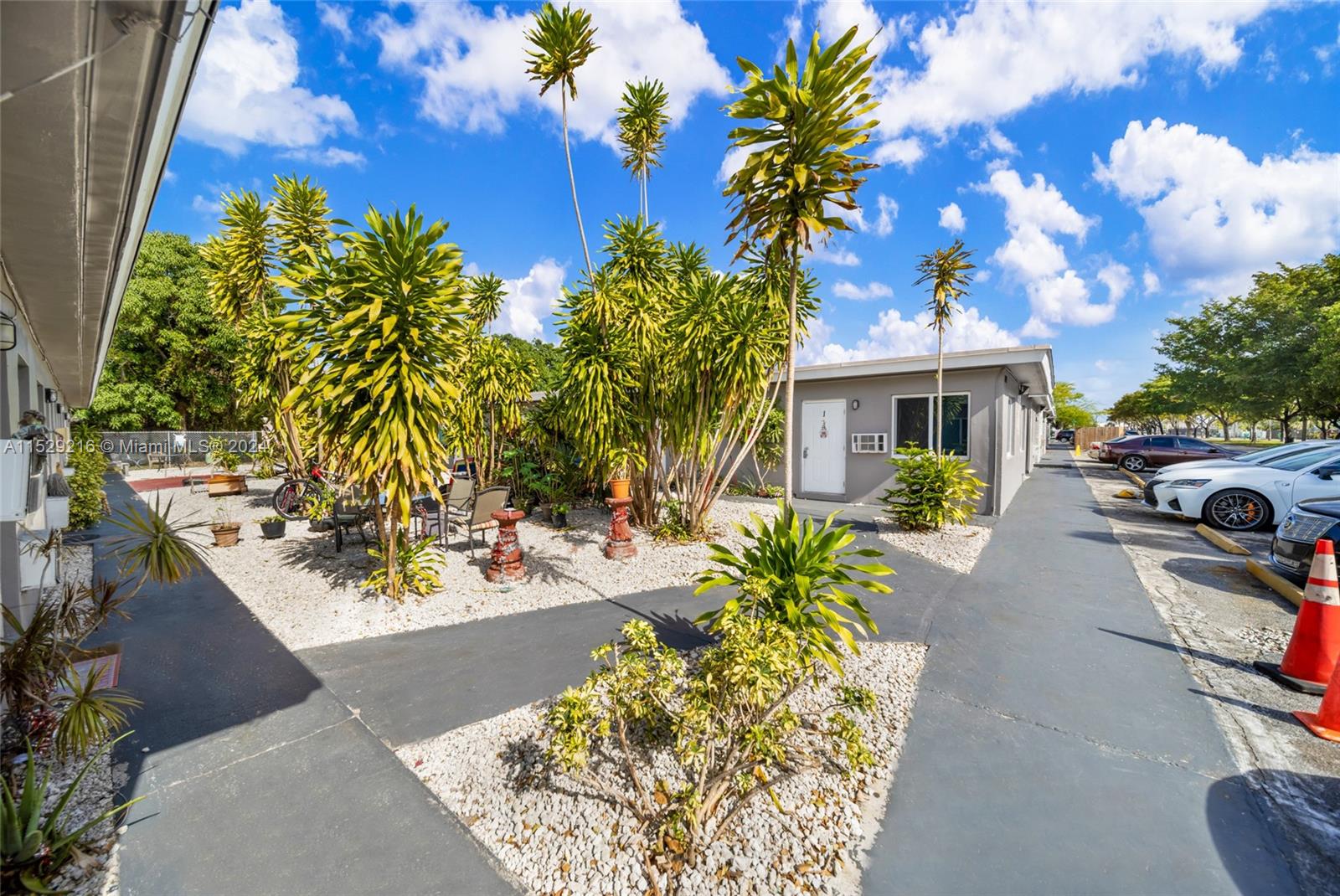 1219 Sharazad Boulevard Opa-Locka, FL 33054 - Photo 6 of 16 a view of a yard with a fountain