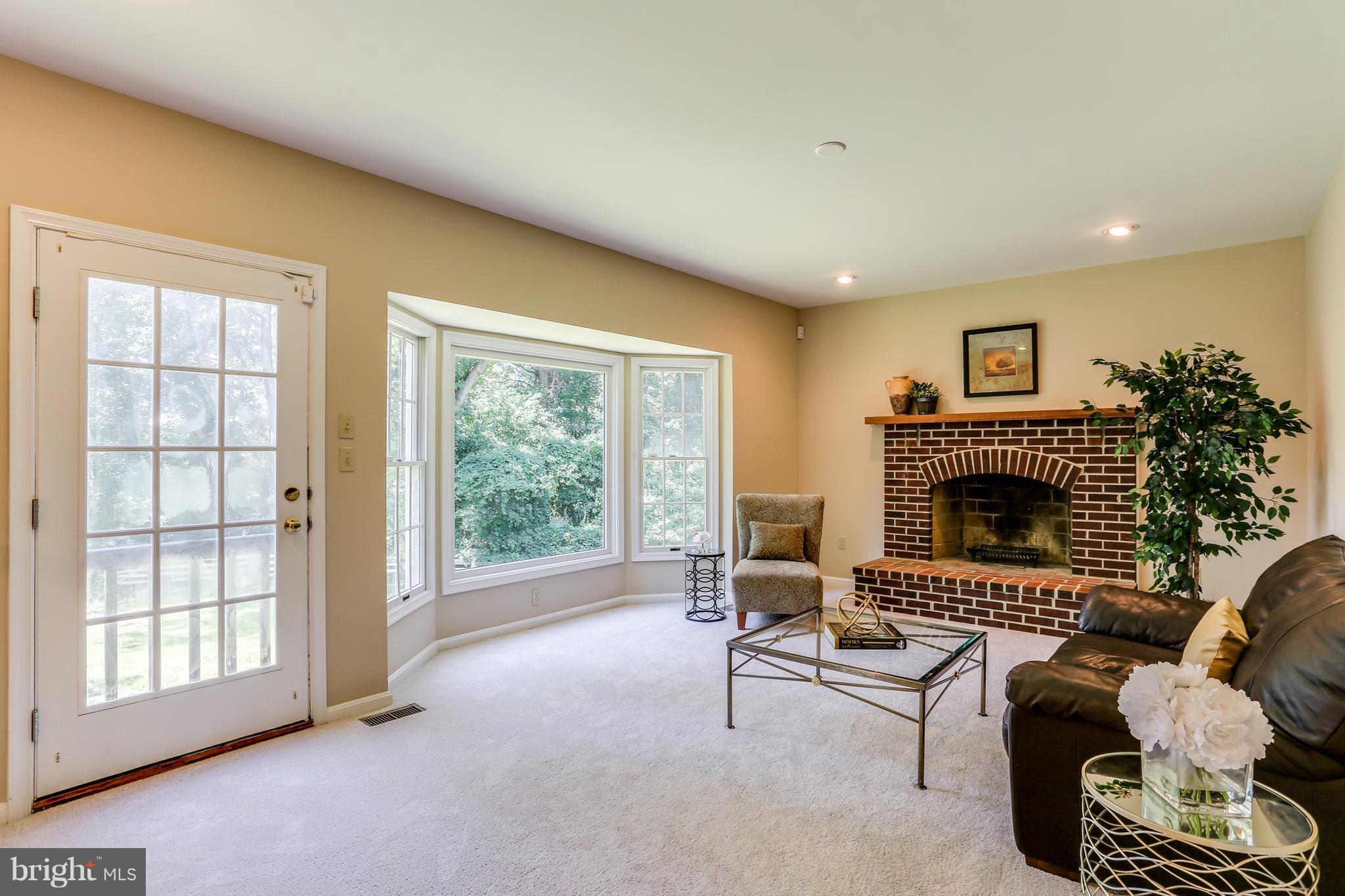 8258 Spring Branch Court Laurel, MD 20723 - Photo 12 of 26 a living room with furniture and a fireplace