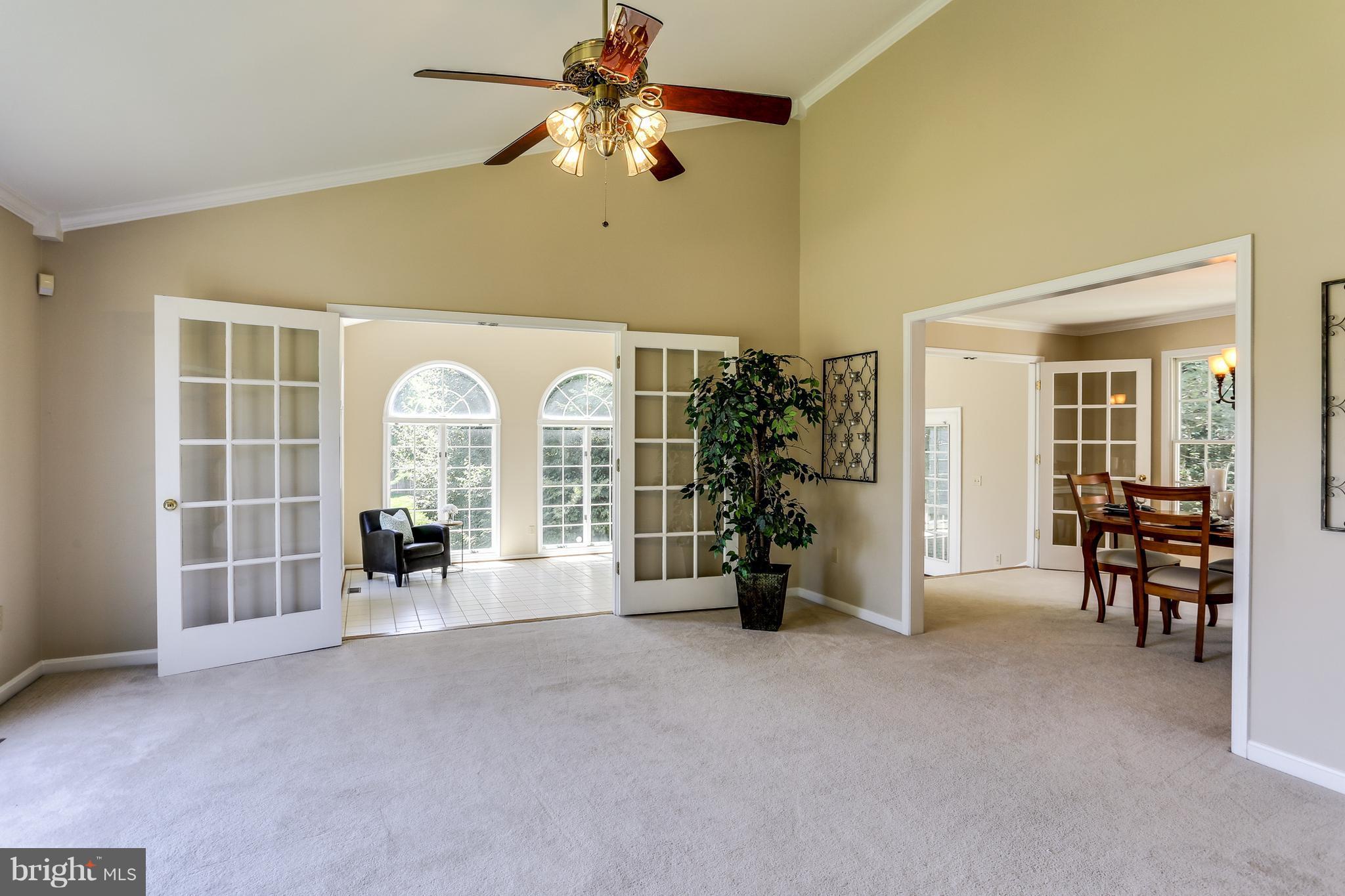 8258 Spring Branch Court Laurel, MD 20723 - Photo 3 of 26 a view of a livingroom with a furniture and a ceiling fan