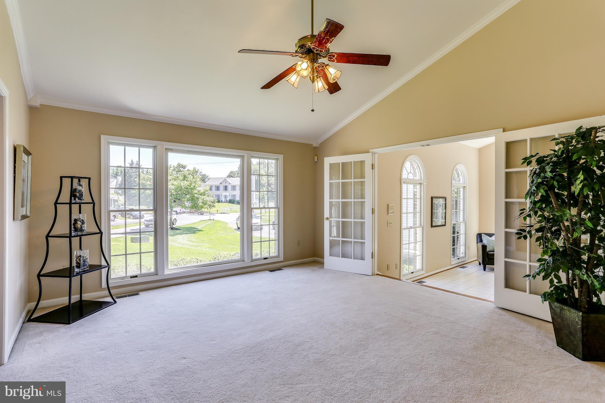 8258 Spring Branch Court Laurel, MD 20723 - Photo 4 of 26 a view of an empty room with a window
