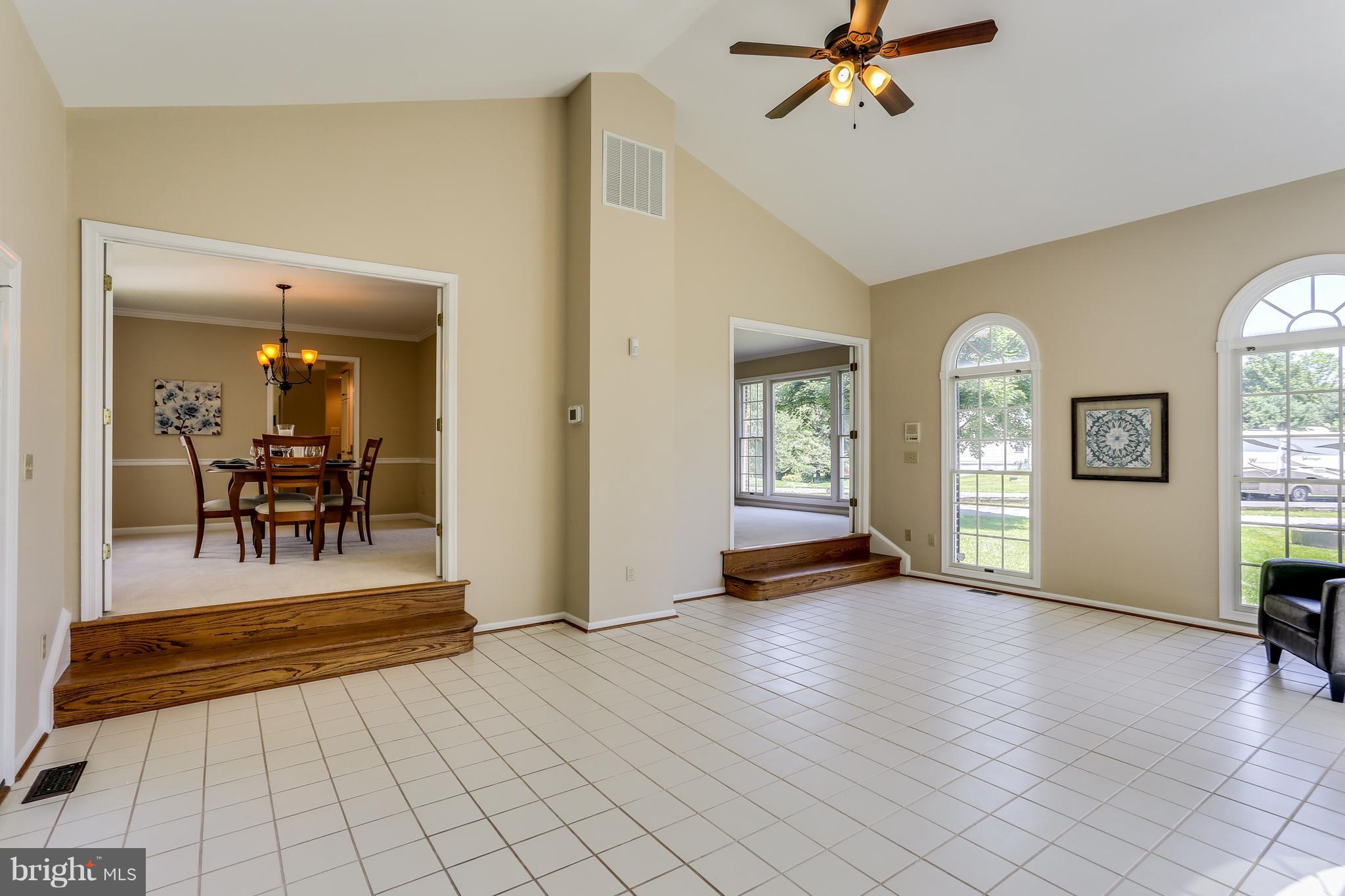 8258 Spring Branch Court Laurel, MD 20723 - Photo 6 of 26 a view of a livingroom with a furniture wooden floor and windows