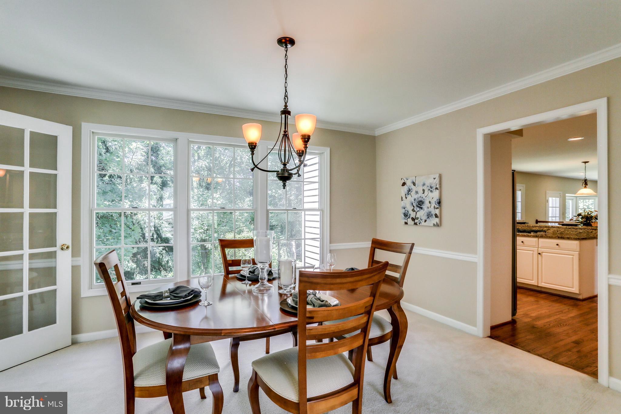 8258 Spring Branch Court Laurel, MD 20723 - Photo 7 of 26 a view of a dining room with furniture window and outside view