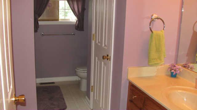 80 Maple Road Huntland, TN 37345 - Photo 9 of 12 Guest bath is centrally located in the home and is shared between 2nd and 3rd bedroom. Offers a tub/shower combo.