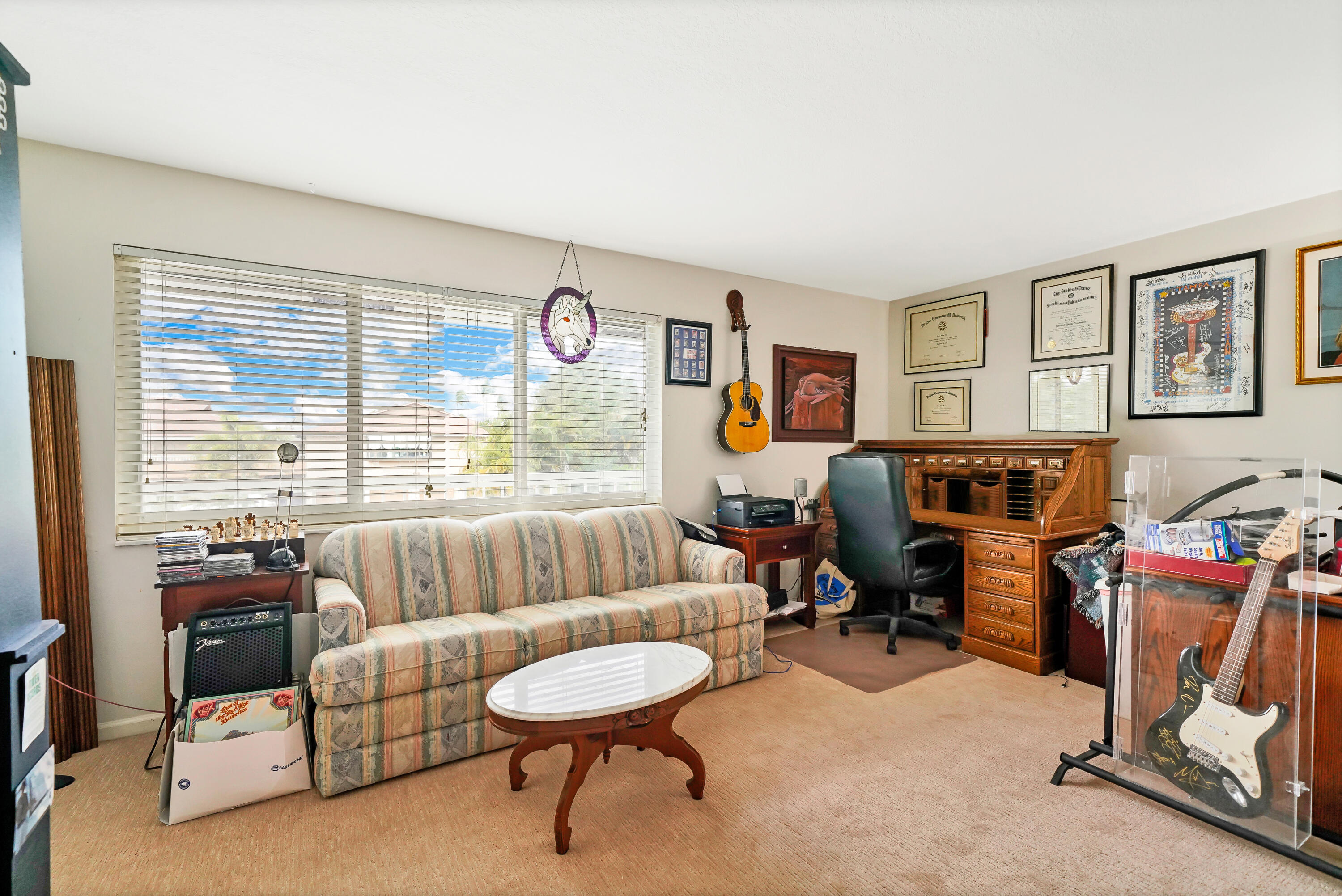 3110 Surf Way, Unit 2 Singer Island, FL 33404 - Photo 13 of 15 a living room with furniture and a large window