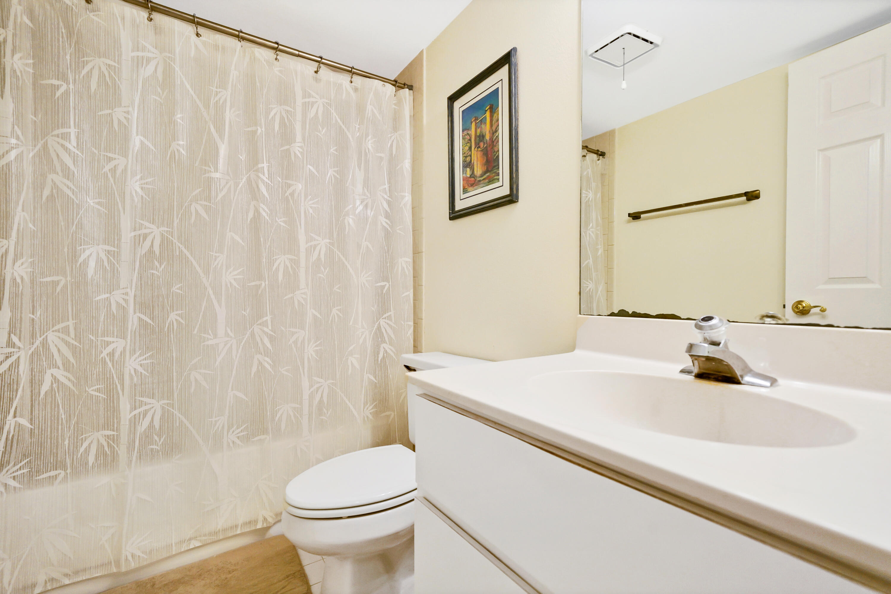 3110 Surf Way, Unit 2 Singer Island, FL 33404 - Photo 14 of 15 a bathroom with a sink toilet and shower