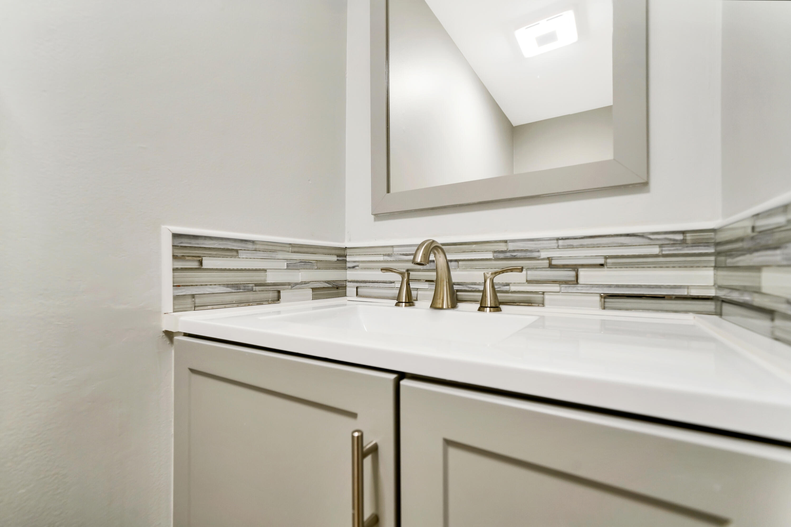 3110 Surf Way, Unit 2 Singer Island, FL 33404 - Photo 10 of 15 a sink with a close view of mirror