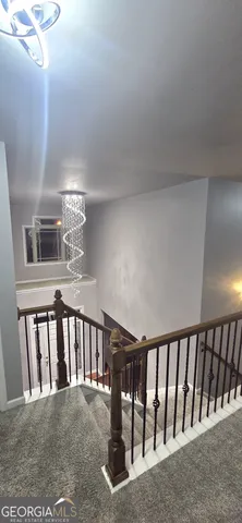 a view of a hallway with windows