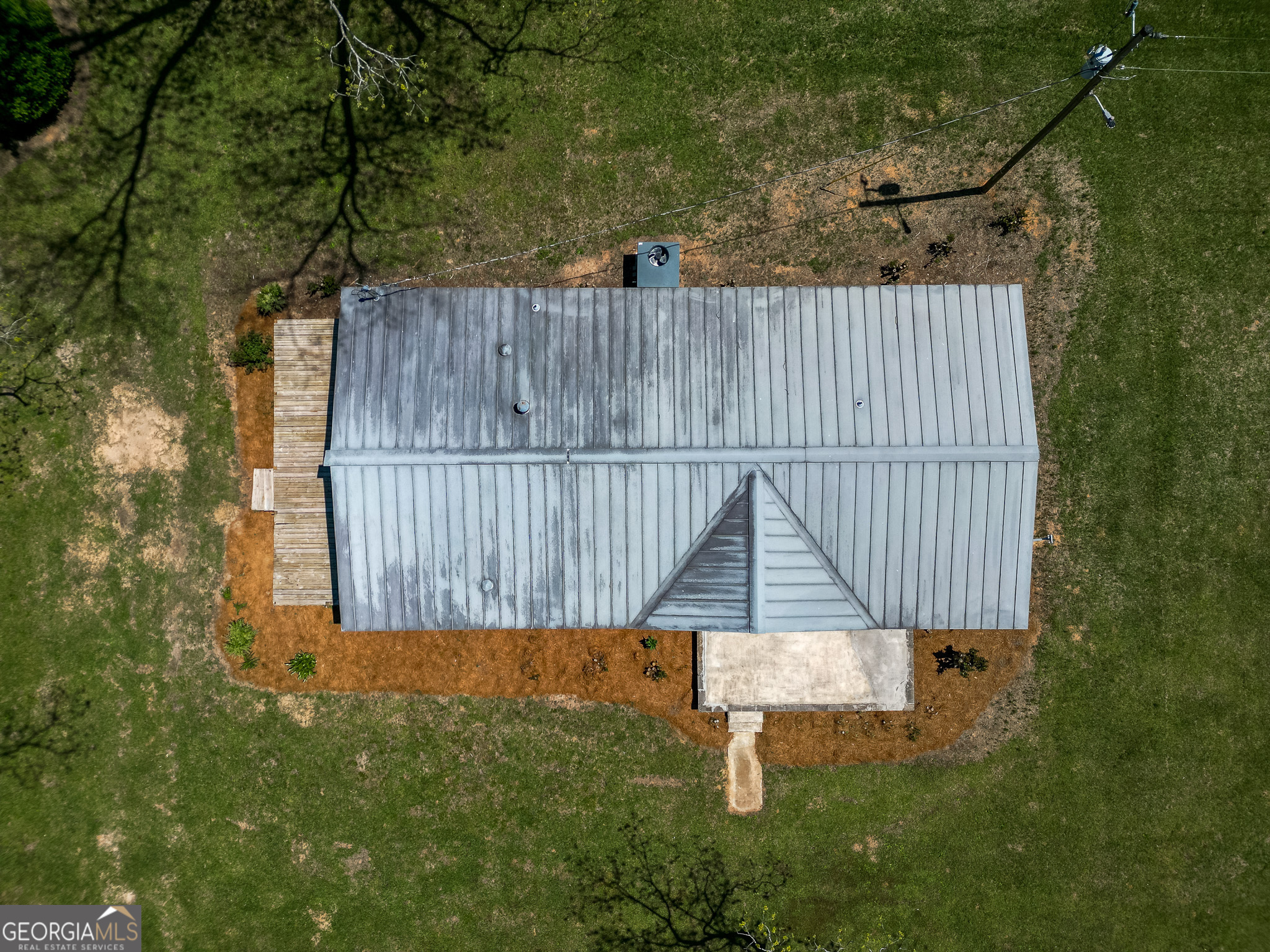 2055 Payne Pond Road Weston, GA 31832 - Photo 17 of 20 a view of a backyard with a wooden fence