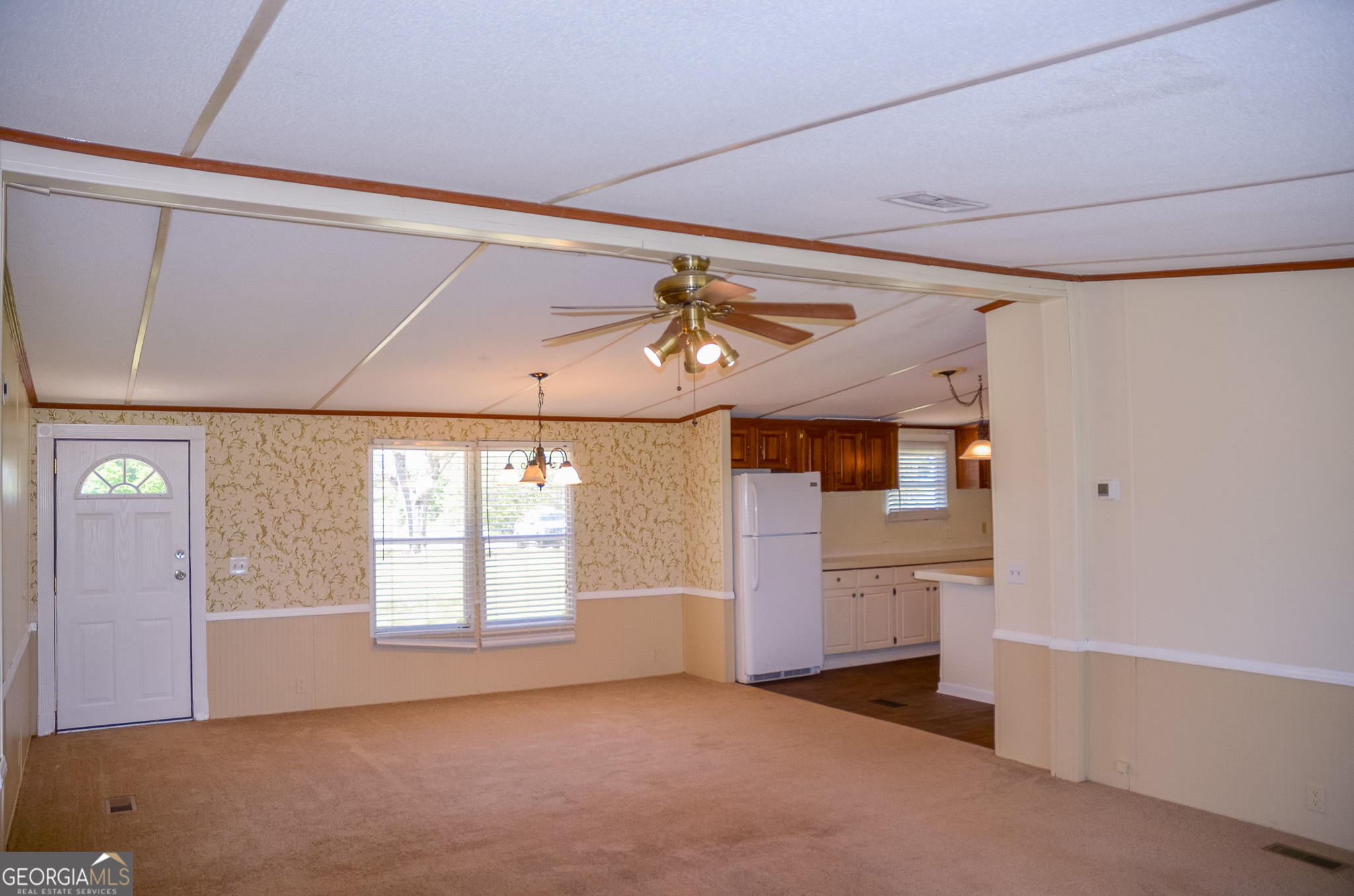 2055 Payne Pond Road Weston, GA 31832 - Photo 4 of 20 en empty room with windows and ceiling fan