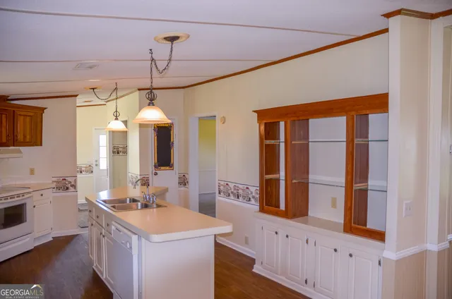 a bathroom with a sink a vanity and a large mirror