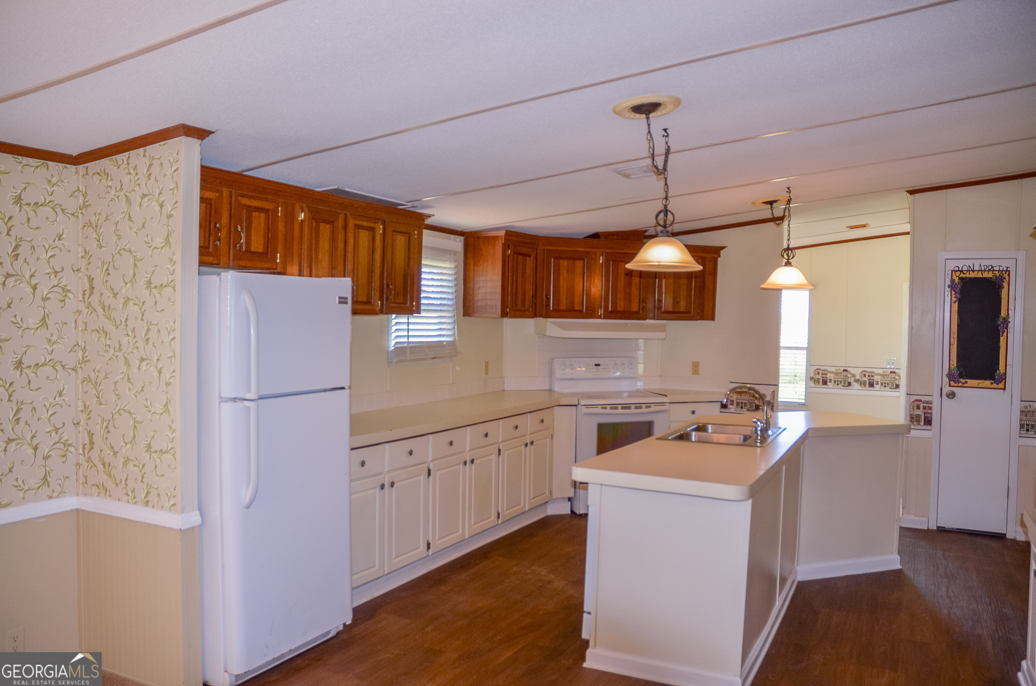 2055 Payne Pond Road Weston, GA 31832 - Photo 7 of 20 a kitchen that has a lot of cabinets and wooden floor