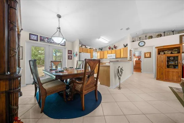 a dining room with furniture and window