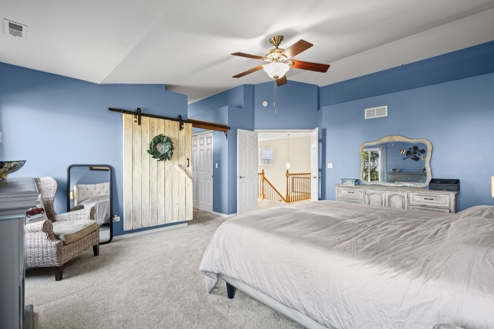 26832 West Hemlock Road Channahon, IL 60410 - Photo 17 of 25 a bedroom with a bed and a chandelier