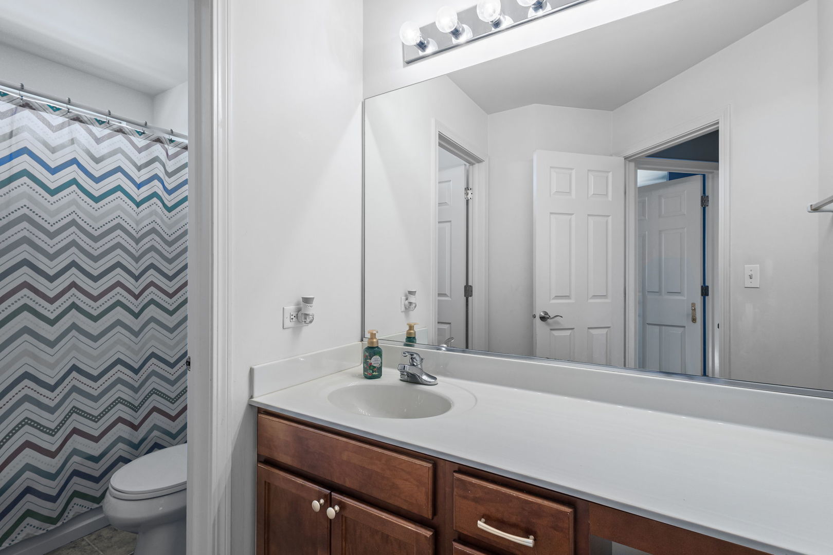 26832 West Hemlock Road Channahon, IL 60410 - Photo 19 of 25 a bathroom with a granite countertop sink a toilet and a mirror