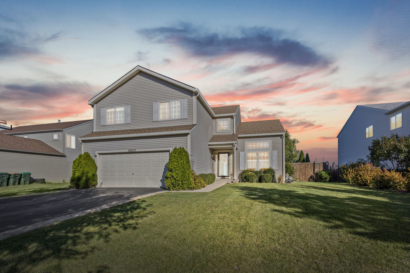 26832 West Hemlock Road Channahon, IL 60410 - Photo 2 of 25 a view of a big house with a big yard and plants