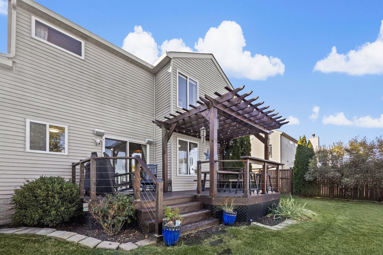 26832 West Hemlock Road Channahon, IL 60410 - Photo 25 of 25 a view of a house with a yard and potted plants