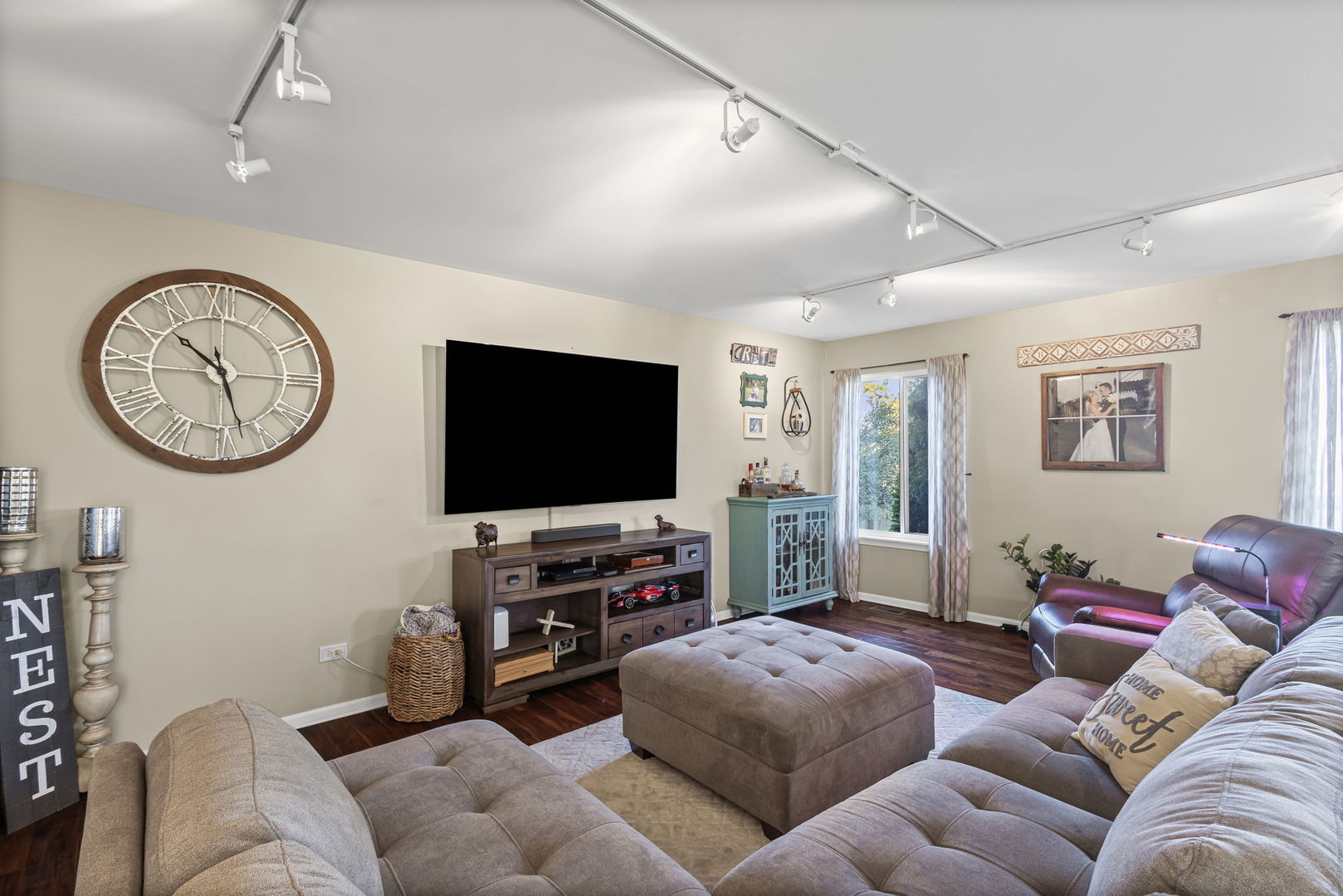 26832 West Hemlock Road Channahon, IL 60410 - Photo 10 of 25 a living room with furniture a window and a flat screen tv
