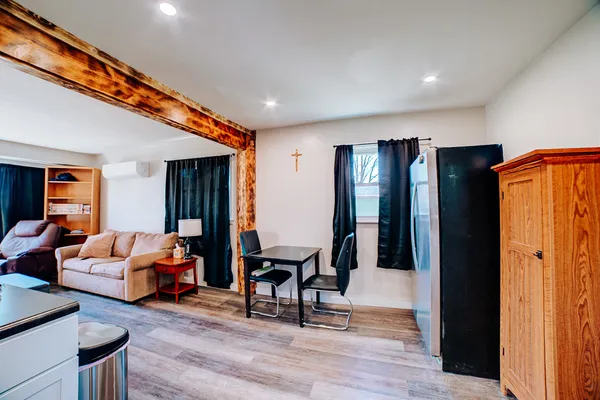 a livingroom with furniture and wooden floor