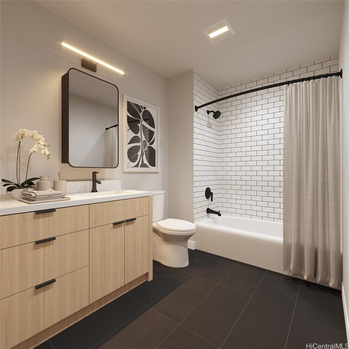 2599 Kapiolani Boulevard, Unit 2817 Honolulu, HI 96826 - Photo 5 of 25 a bathroom with a toilet a sink and mirror