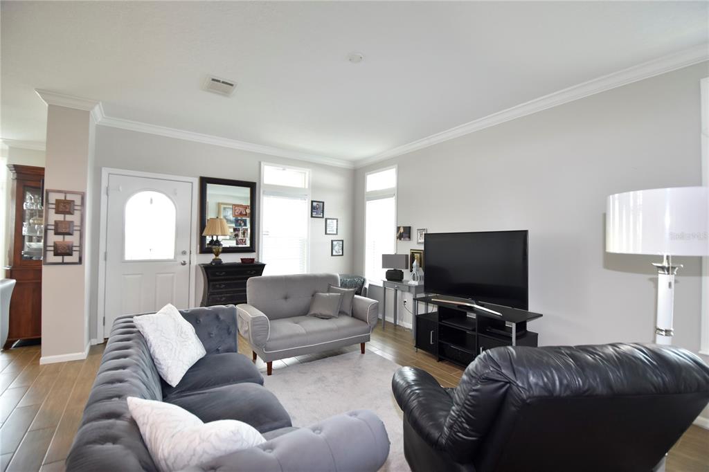 4354 North Manatee Loop, Unit 16A Punta Gorda, FL 33980 - Photo 11 of 33 a living room with furniture and a flat screen tv