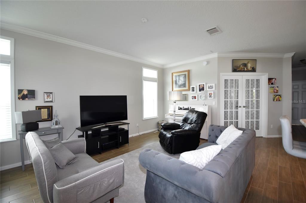 4354 North Manatee Loop, Unit 16A Punta Gorda, FL 33980 - Photo 12 of 33 a living room with furniture and a flat screen tv