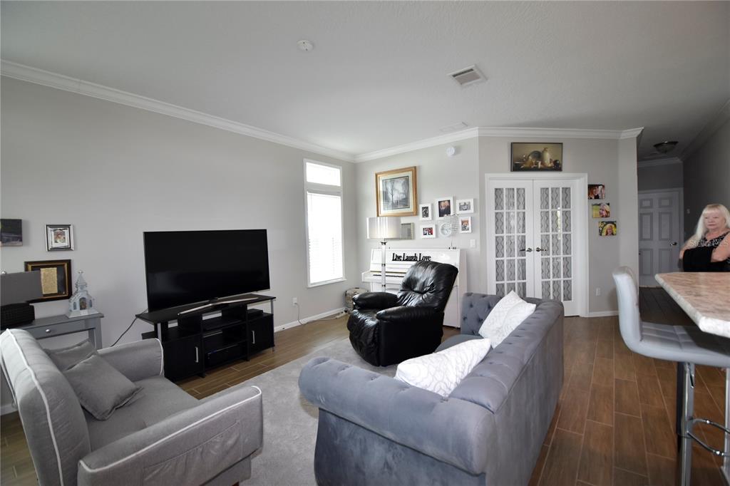 4354 North Manatee Loop, Unit 16A Punta Gorda, FL 33980 - Photo 13 of 33 a living room with furniture and a flat screen tv