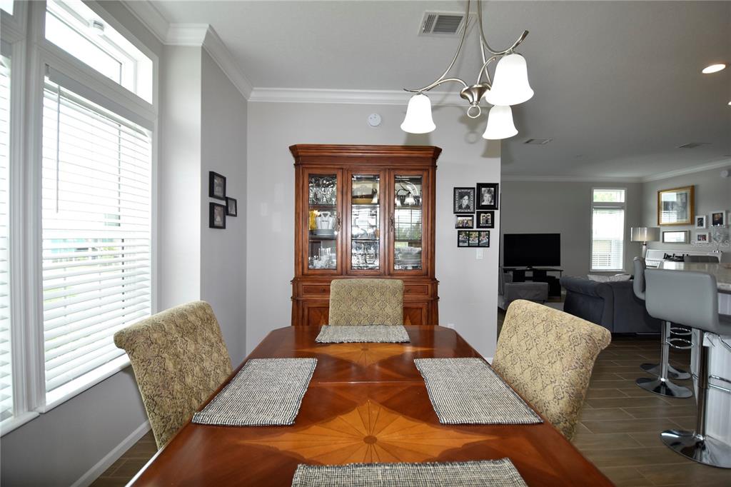 4354 North Manatee Loop, Unit 16A Punta Gorda, FL 33980 - Photo 20 of 33 a living room with furniture and a chandelier