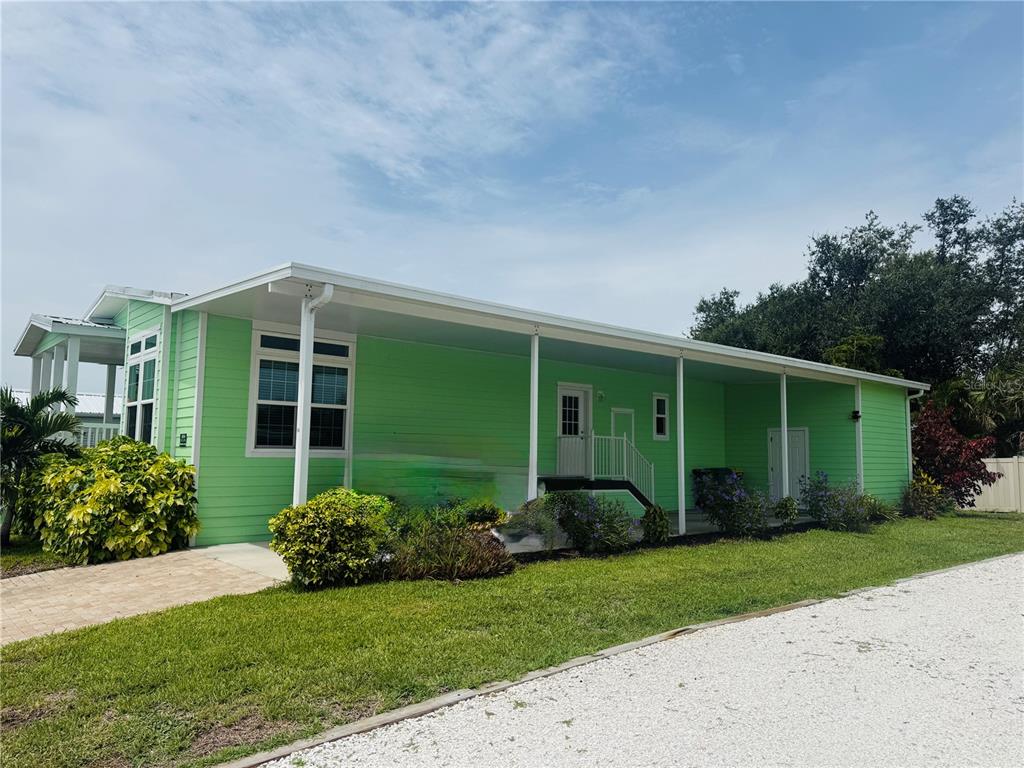 4354 North Manatee Loop, Unit 16A Punta Gorda, FL 33980 - Photo 2 of 33 a front view of a house with garden