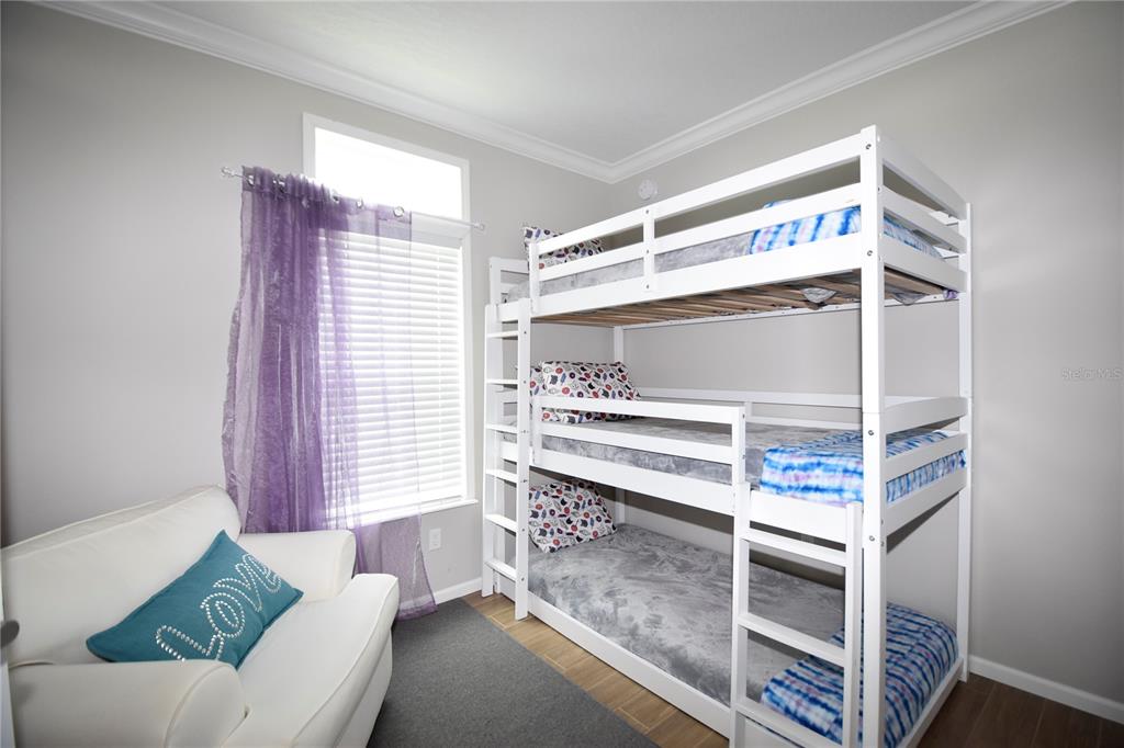 4354 North Manatee Loop, Unit 16A Punta Gorda, FL 33980 - Photo 21 of 33 a bedroom with furniture and a window