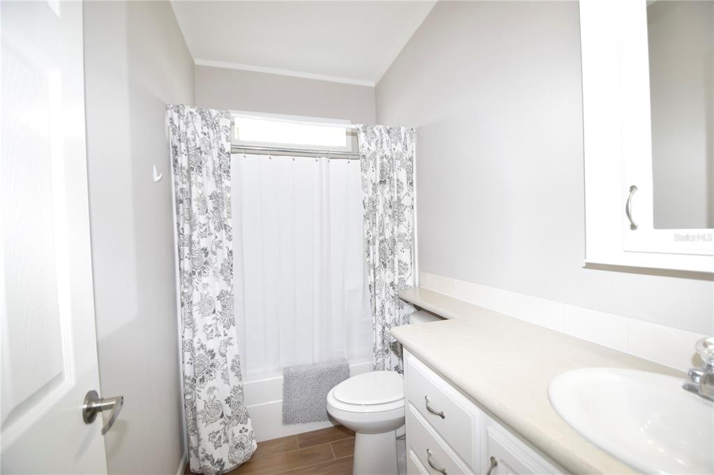 4354 North Manatee Loop, Unit 16A Punta Gorda, FL 33980 - Photo 22 of 33 a bathroom with a sink toilet and shower