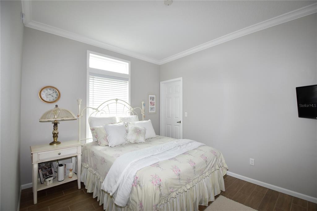 4354 North Manatee Loop, Unit 16A Punta Gorda, FL 33980 - Photo 23 of 33 a bedroom with a bed and a window