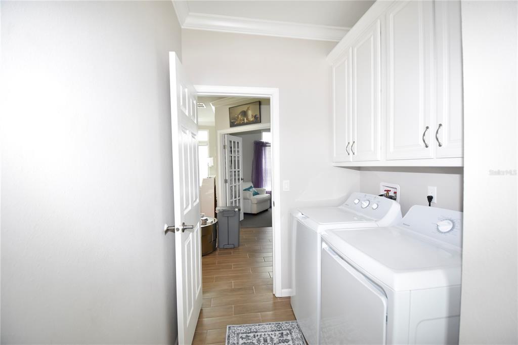 4354 North Manatee Loop, Unit 16A Punta Gorda, FL 33980 - Photo 26 of 33 a hallway with a sink and cabinets