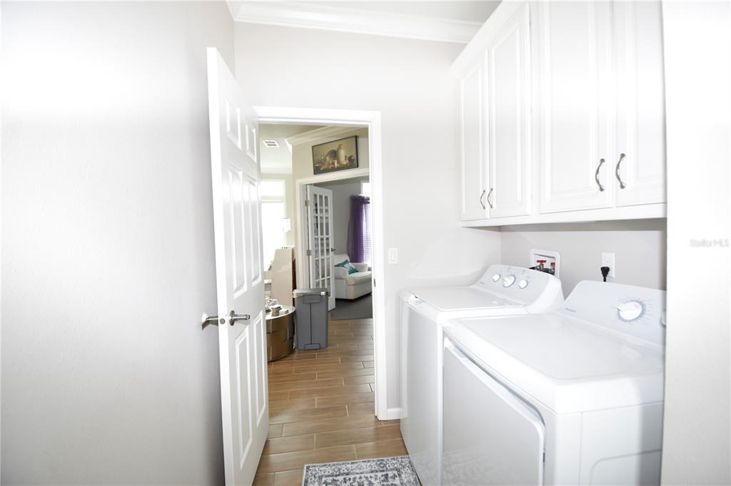 4354 North Manatee Loop, Unit 16A Punta Gorda, FL 33980 - Photo 27 of 33 a hallway with a sink and cabinets