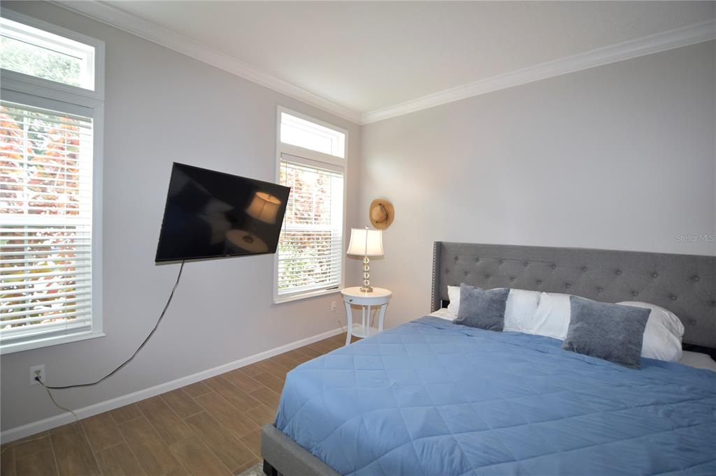 4354 North Manatee Loop, Unit 16A Punta Gorda, FL 33980 - Photo 28 of 33 a bedroom with a bed and a flat screen tv