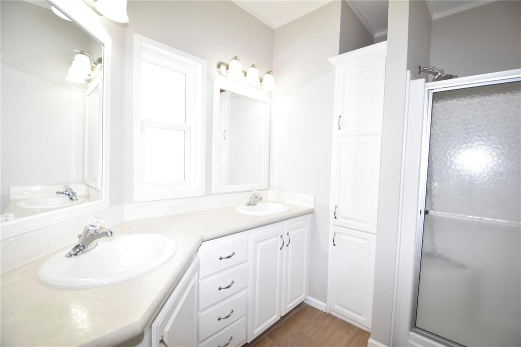 4354 North Manatee Loop, Unit 16A Punta Gorda, FL 33980 - Photo 29 of 33 a bathroom with a double vanity sink mirror and double