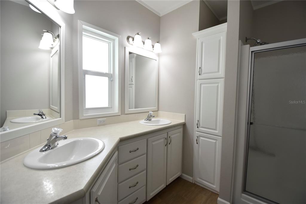 4354 North Manatee Loop, Unit 16A Punta Gorda, FL 33980 - Photo 30 of 33 a bathroom with a double vanity sink mirror and